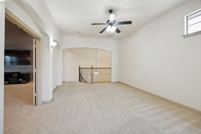 Unfurnished room featuring carpet flooring, ceiling fan, and baseboards | Image 25
