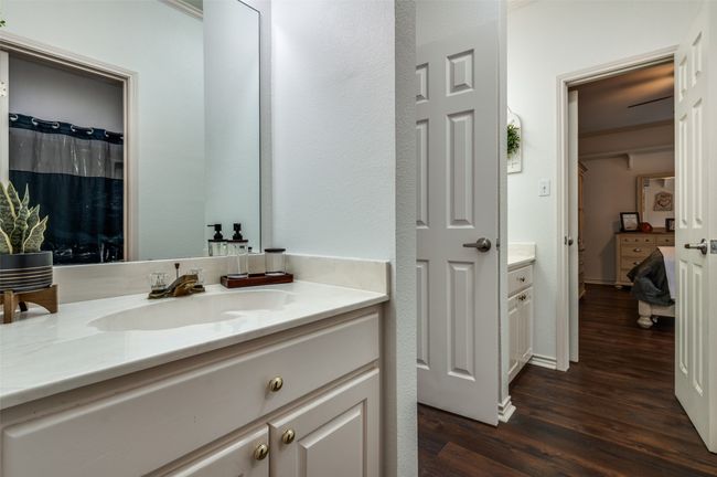 Bathroom with ensuite bath, two vanities and separate shower/tub and comode room | Image 22