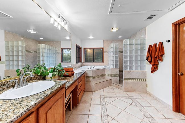 Full bath featuring tile patterned floors, double vanity, a bath, and tiled​​‌​​​​‌​​‌‌​‌‌​​​‌‌​​‌‌​‌​​​​​‌ shower | Image 29