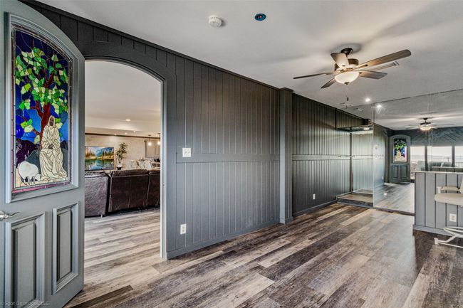 Second living area or game room with patio access and shower | Image 13