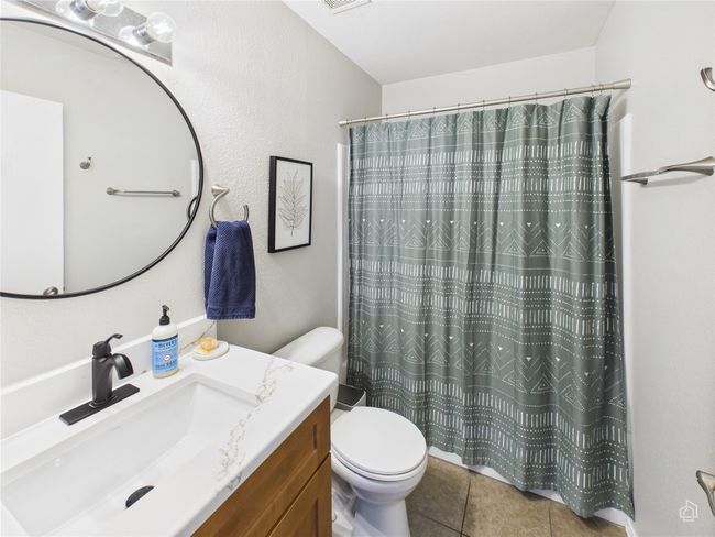 Bathroom featuring vanity, tile patterned floors, and a shower with shower curtain | Image 22