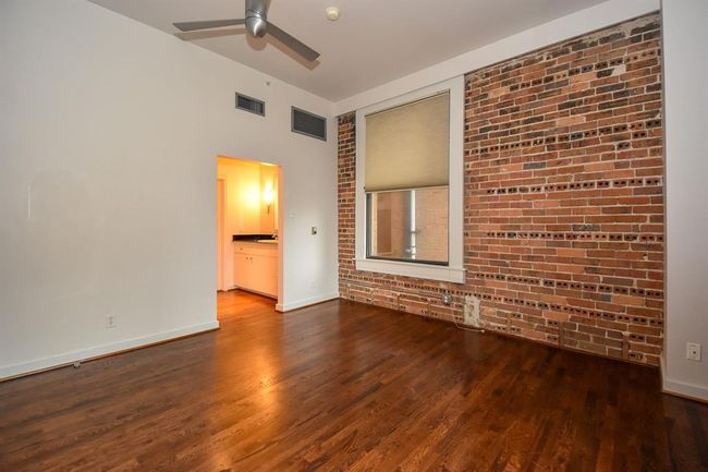 Spacious primary bedroom featuring large windows that fill the room with natural light. The room includes a well-sized closet, offering ample storage | Image 23