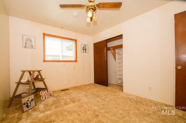 Unfurnished bedroom featuring carpet floors and a ceiling fan | Image 27