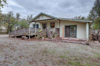 View of front facade featuring covered porch and a deck | Image 1