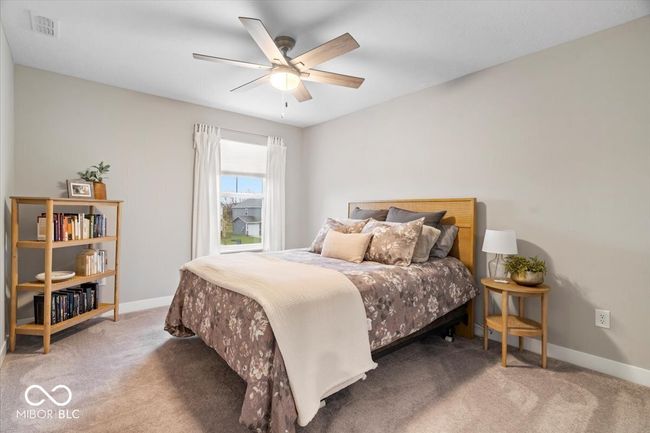 carpeted bedroom with baseboards and ceiling fan | Image 27