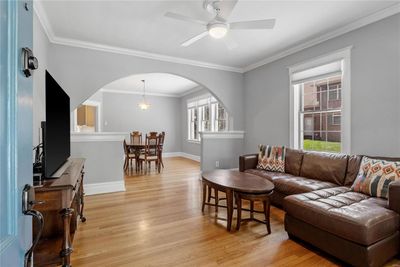 Living room filled with natural light, wood flooring | Image 2