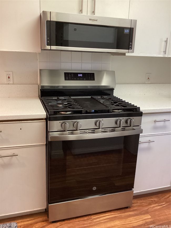 Recently installed gas stove and recessed microwave | Image 12