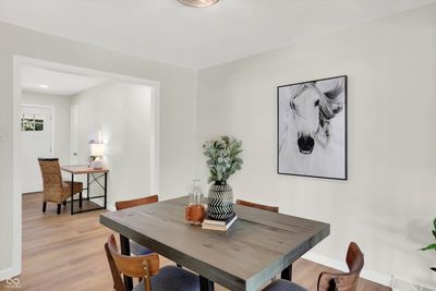 The dining room separates the renovated kitchen from the family room. | Image 3