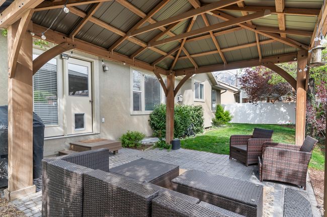 View of patio / terrace with a gazebo, fence, and an outdoor living space | Image 22