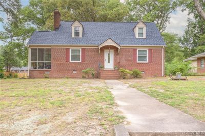 Cape cod house with a front yard | Image 1