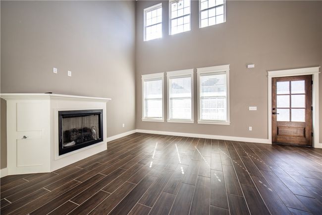 Living area has fireplace | Image 10
