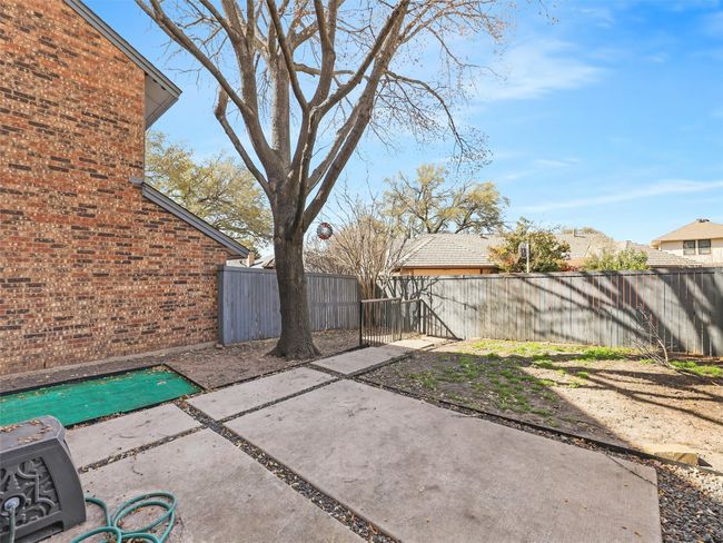 View of patio with a fenced backyard | Image 32