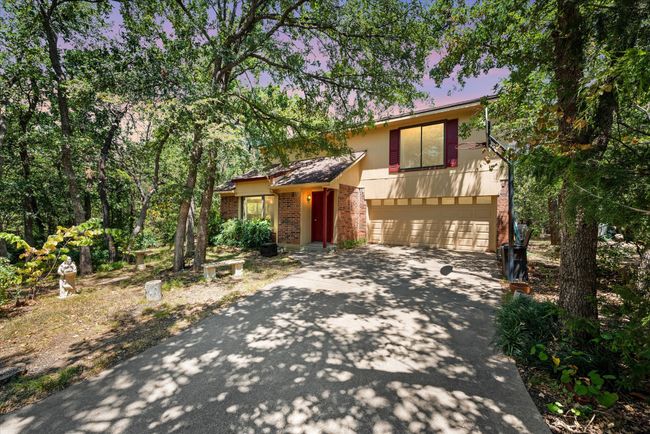 Split level home featuring a garage | Image 28