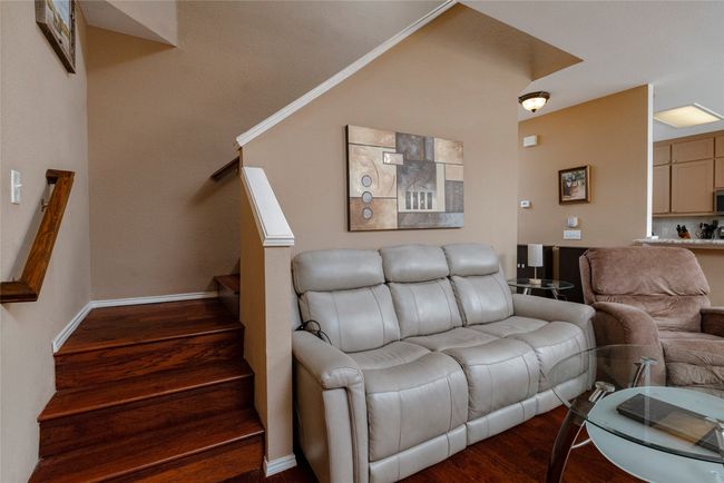 Living room with baseboards, stairs, and dark wood finished floors | Image 18