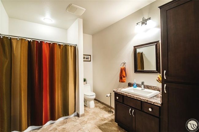 There is a full bathroom downstairs in the basement | Image 27