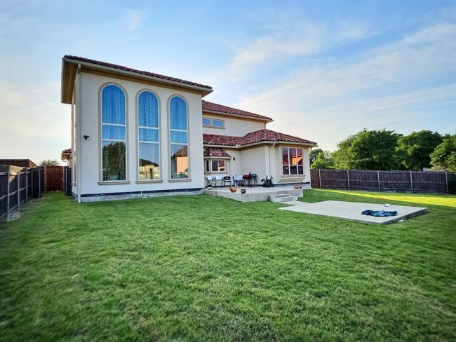 Back of property with a patio, a tile roof, and stucco siding | Image 35