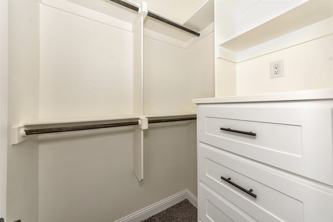 Walk in closet with carpet floors | Image 31