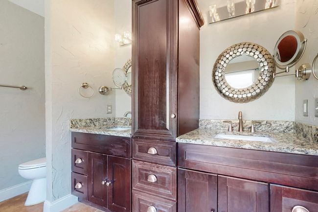 Bathroom with toilet, vanity, and baseboards | Image 22