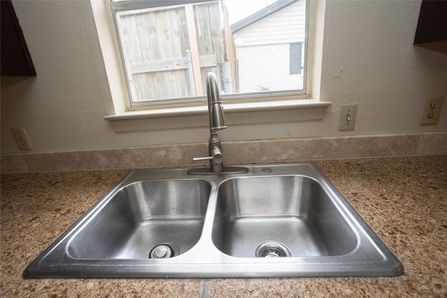 Kitchen view of a sink | Image 10