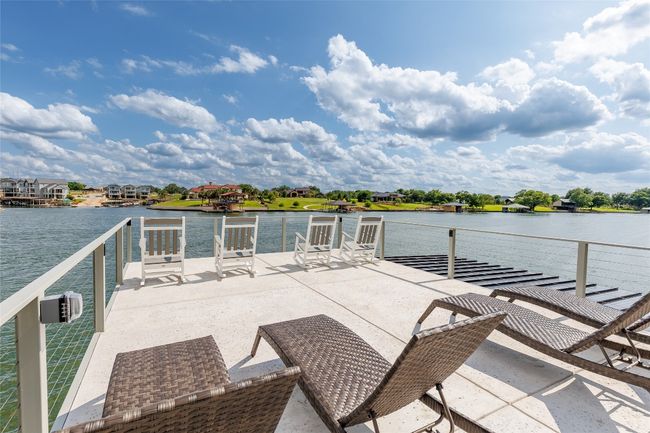 2-slip boat dock with party deck for lakeside fun. | Image 38