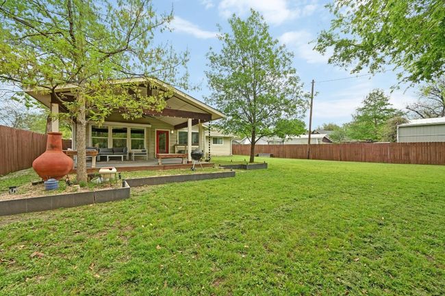 Nestled on a huge over quarter acre lot backing to a wet water creek with a line of woods, providing for excellent privacy while entertaining and relaxing on the oversized covered back porch. | Image 5