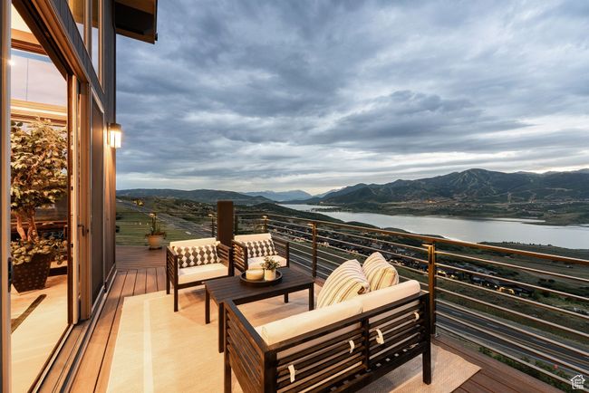 Balcony with a water and mountain view and outdoor lounge area | Image 30