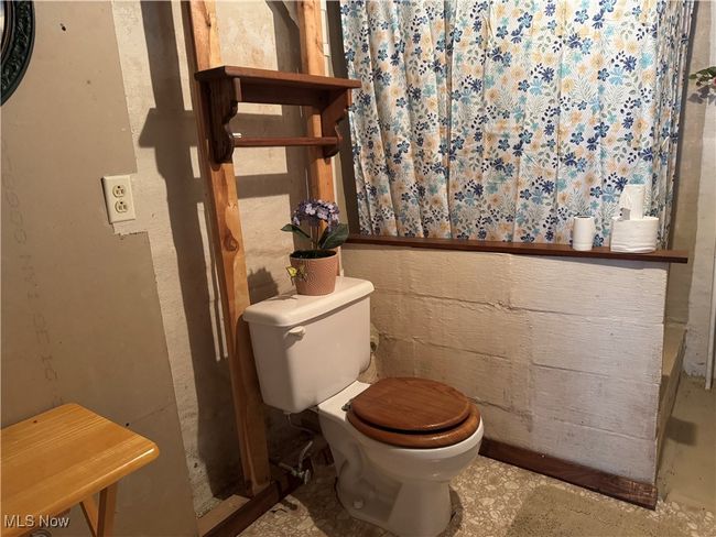 half bath-shower- commodode in basement | Image 33