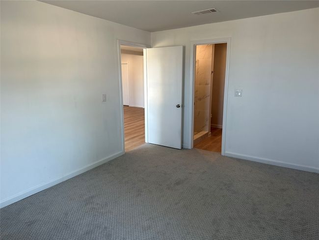 Unfurnished bedroom with baseboards, visible vents, and carpet | Image 15