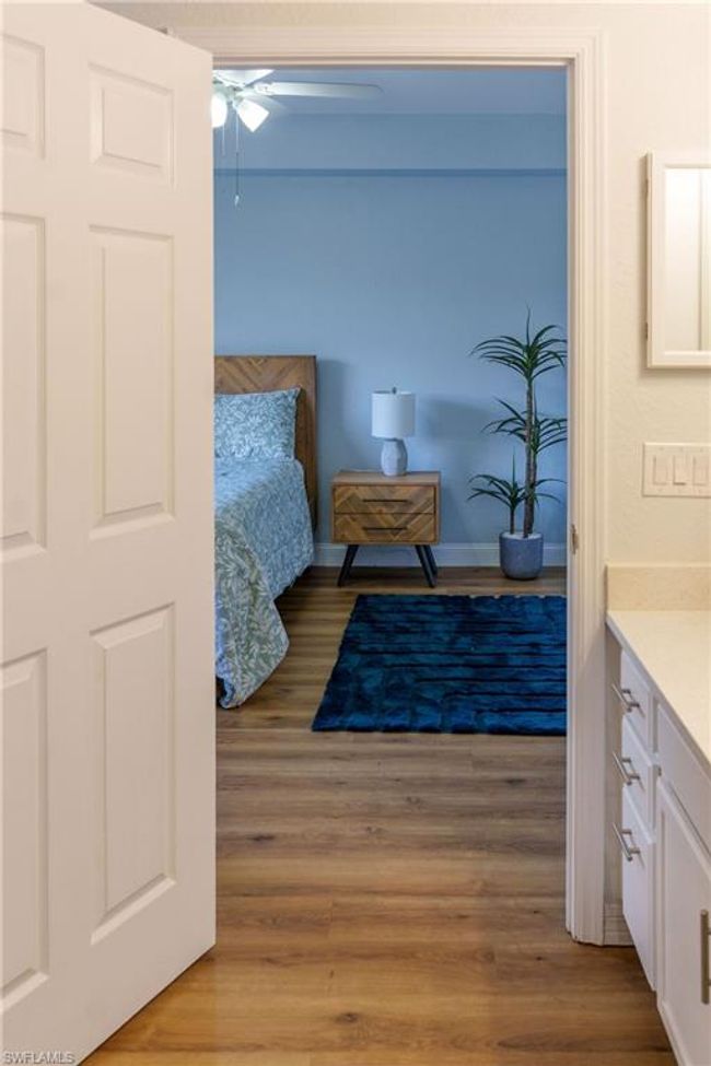 Bedroom featuring wood finished floors | Image 22