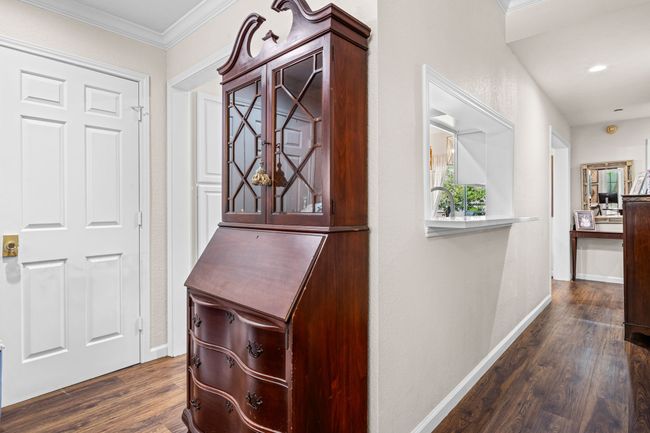 Hallway featuring dark wood-style flooring and ornamental molding | Image 12