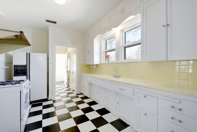 The laundry room/mud room is at the end of the kitchen through the door. | Image 16