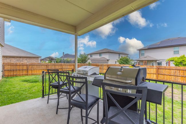 View of patio featuring a fenced backyard and a residential view | Image 39