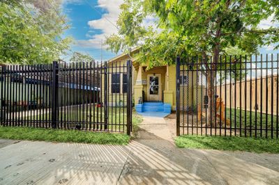 Fully fenced with a driveway gate that provides privacy and security. | Image 2