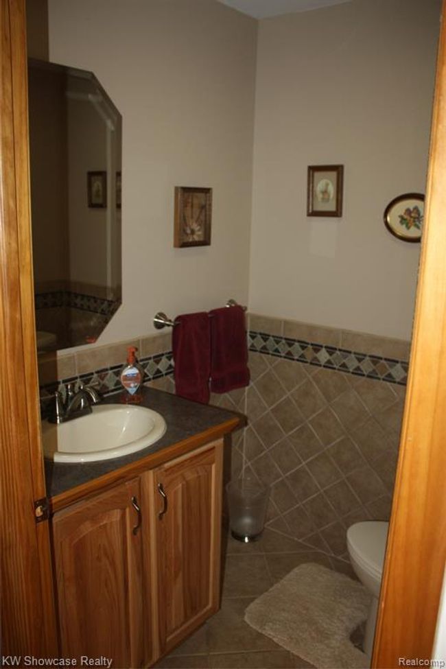 Main floor half bathroom. | Image 21