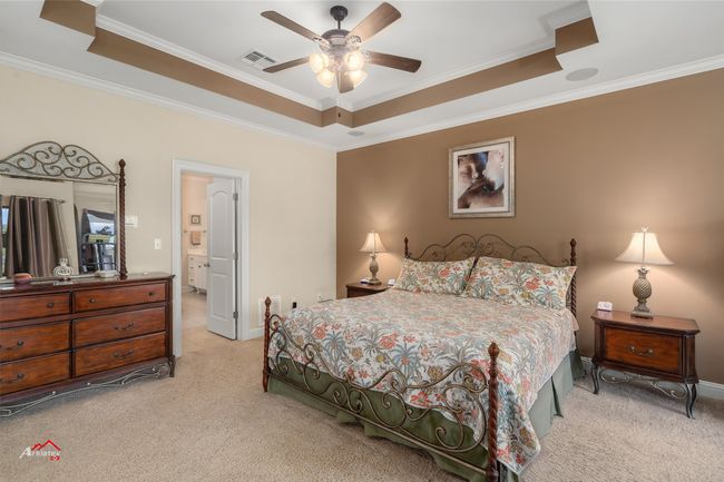 Primary bedroom with ceiling detail. | Image 28