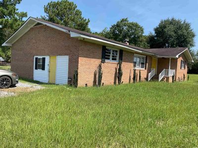 View of side of home featuring a yard | Image 2