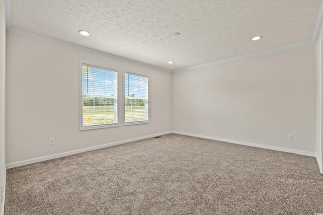 Empty room featuring baseboards, ornamental molding, and carpet floors | Image 13