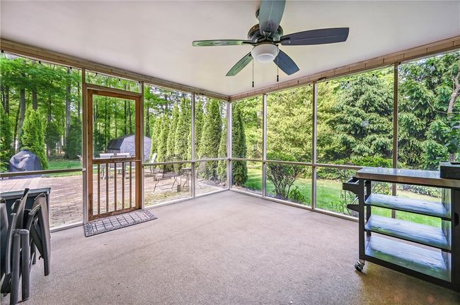 Screened in porch leading to exterior patio | Image 38