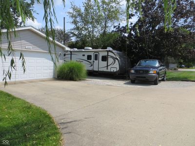 Wide Driveway that includes a graveled RV Pad w/electric receptacle. Plenty of room to park multiple vehicles or toys! | Image 3