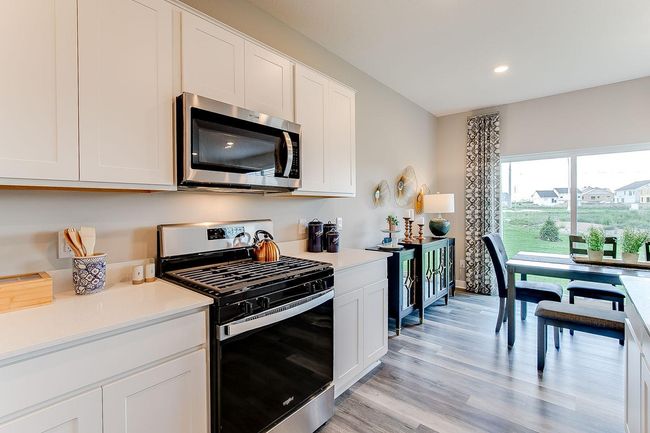 Built to both perform & impress, the home's kitchen offers a heartbeat to the place you'll spend the most time in. Photo of model home, color & options may vary. | Image 5