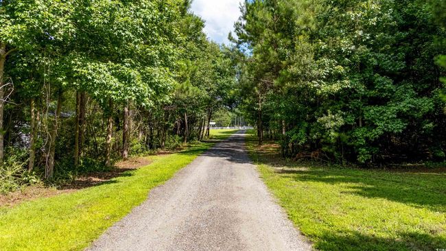 View of dirt / gravel road | Image 11