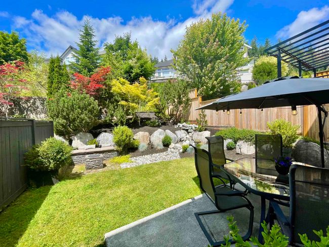 Fenced yard with a patio area | Image 32