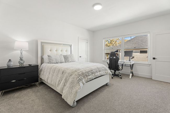 Bedroom featuring light carpet and baseboards | Image 25