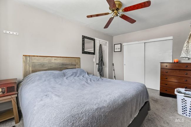 Bedroom featuring carpet and ceiling fan | Image 12