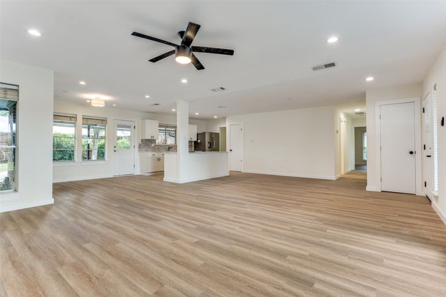 Unfurnished living room with recessed lighting, light wood-style floors, ceiling fan, and baseboards | Image 5