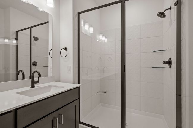You'll find a lovely, spacious walk in shower in this dream owner's bath! | Image 13
