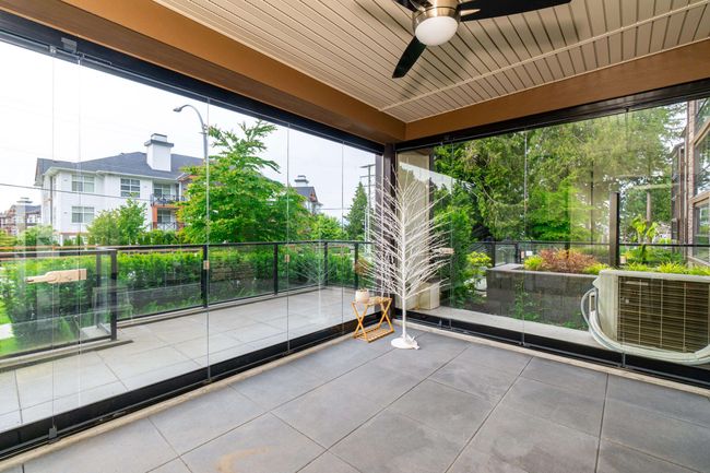 View of patio featuring a ceiling fan and a balcony | Image 27