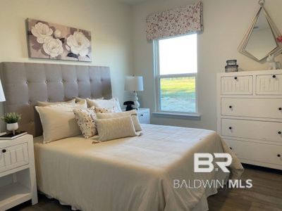 Bedroom featuring dark hardwood / wood-style flooring | Image 3