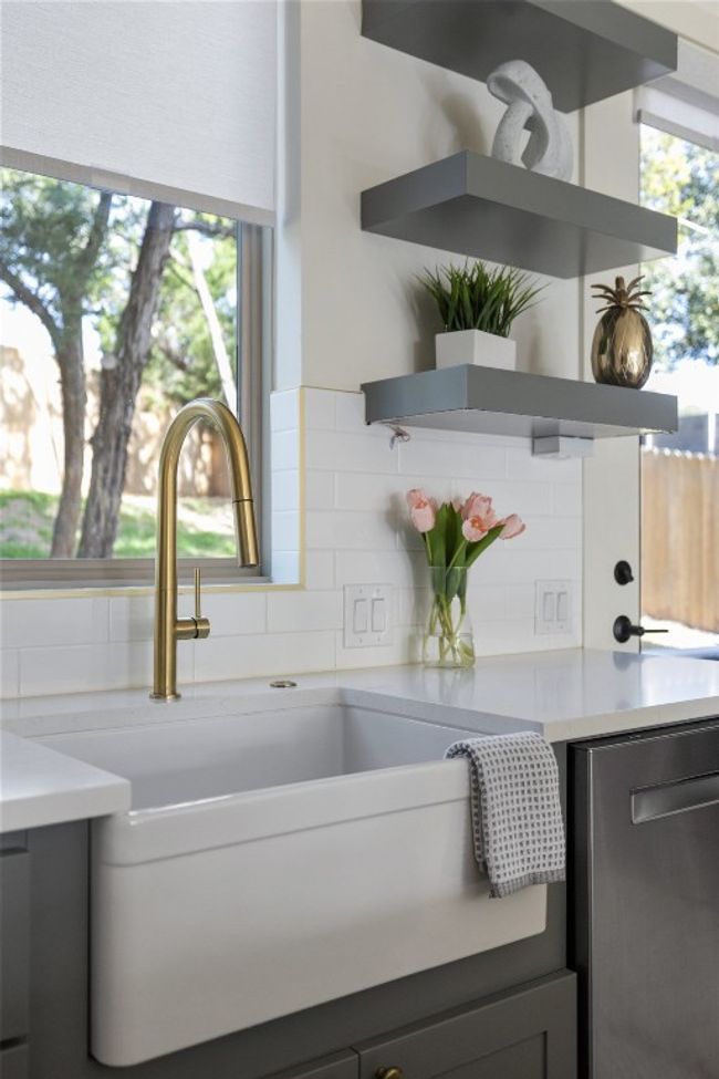 Room details with tasteful backsplash, light countertops, a sink, and open shelves | Image 13