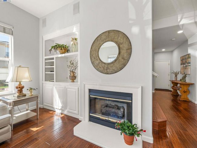 COZY FIREPLACE IN LIVING ROOM AREA | Image 11